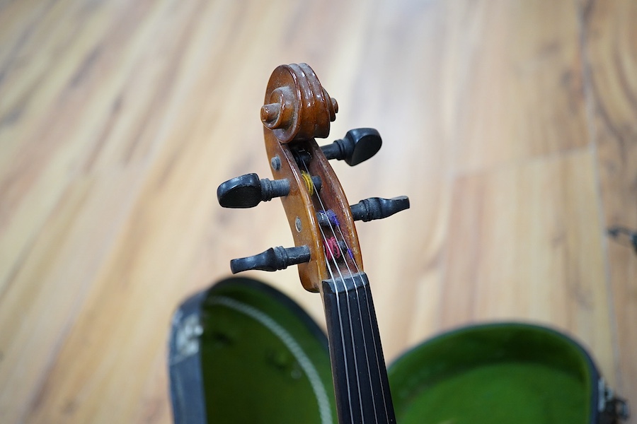 A quantity of violin parts and violins, a ukelele, a double bass scroll, a pinfold metronome, a violin case by Hill, a viola etc. Condition - for restoration